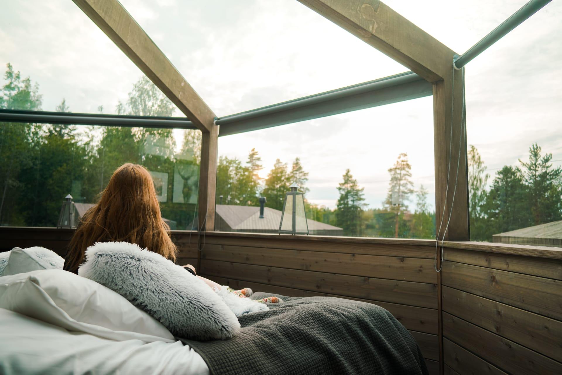 Relaxing inside a glass cabin